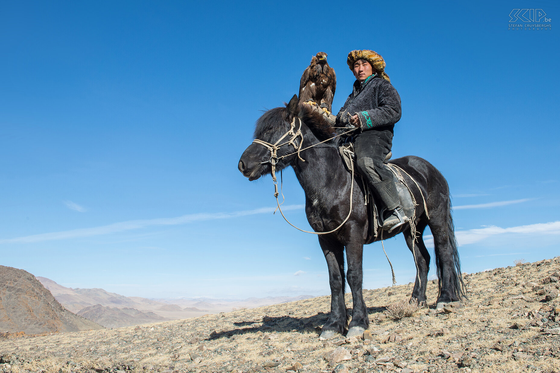 Ulgii - Movie actor Bazarbai Bazarbai is a young eagle hunter of 21 years old. When he was 15, he was the main actor of the international movie ‘The Eagle Hunter's Son’ that tells the story of a Kazakh boy and his journey through Mongolia. His father died recently and now he tries to pass on his knowledge about the eagle hunting to his young sister Amanbol. Stefan Cruysberghs